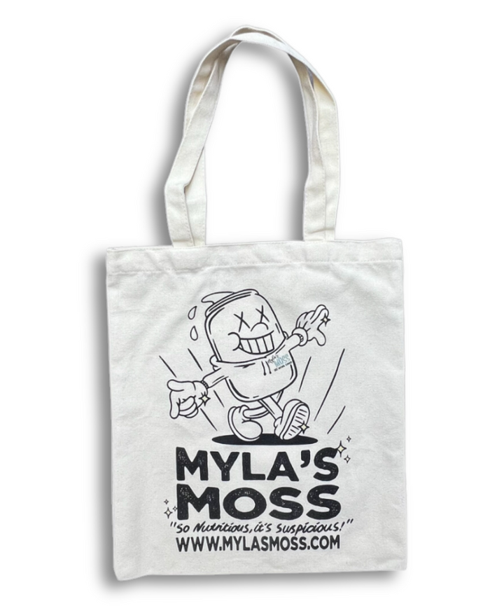 A beige canvas tote bag with a black printed cartoon character and the text 'MYLA'S MOSS' on it.
